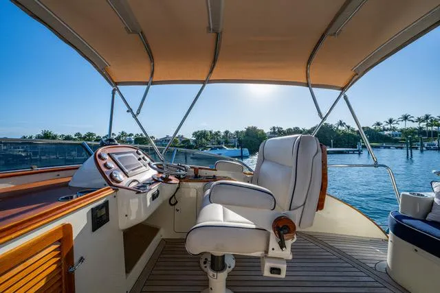 Virginia Yacht Photos Pics Flybridge of 2013 Hinckley Talaria 48, featuring helm station and seating, with scenic water view.