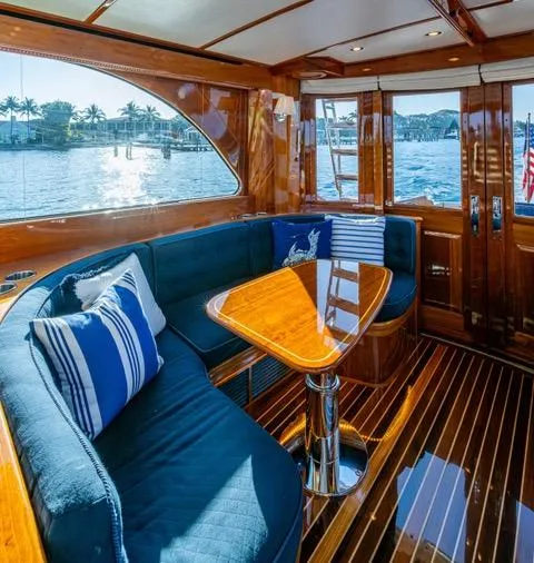 Virginia Yacht Photos Pics Luxurious 2013 Hinckley Talaria 48 Flybridge interior with elegant wood finish and waterfront view.