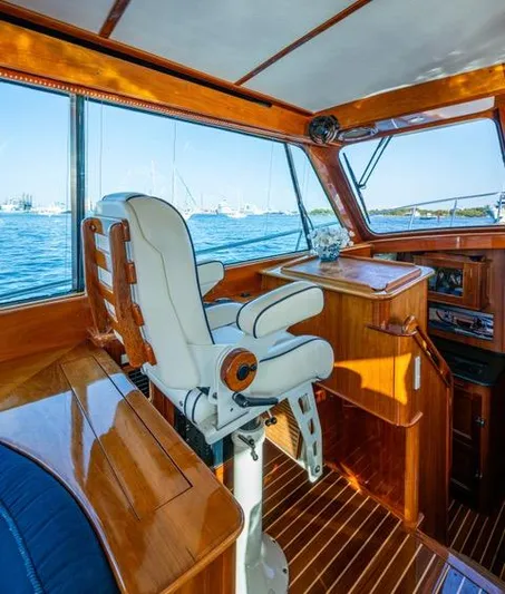 Virginia Yacht Photos Pics 2013 Hinckley Talaria 48 Flybridge helm with luxurious wood finish and ocean view.