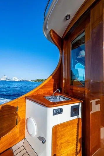 Virginia Yacht Photos Pics 2013 Hinckley Talaria 48 Flybridge yacht with wooden interior and ocean view.