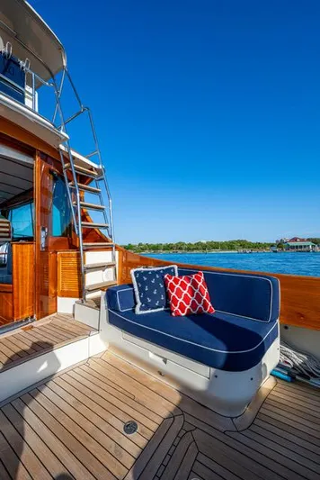 Virginia Yacht Photos Pics 2013 Hinckley Talaria 48 Flybridge yacht with blue seating and decorative pillows.