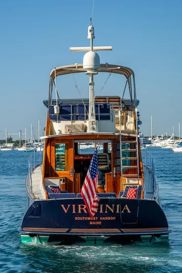 Virginia Yacht Photos Pics 2013 Hinckley Talaria 48 Flybridge yacht on water, rear view with American flag.