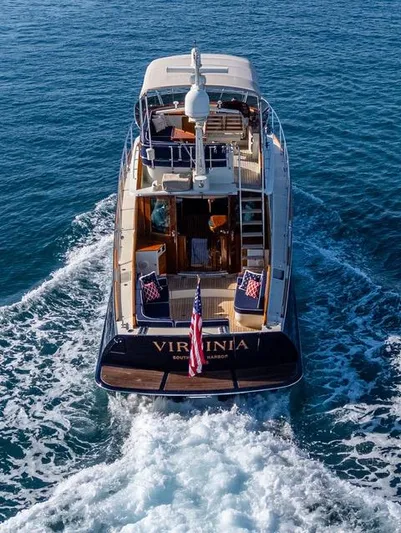 Virginia Yacht Photos Pics Hinckley Talaria 48 Flybridge 2013 yacht cruising on open water, rear view.