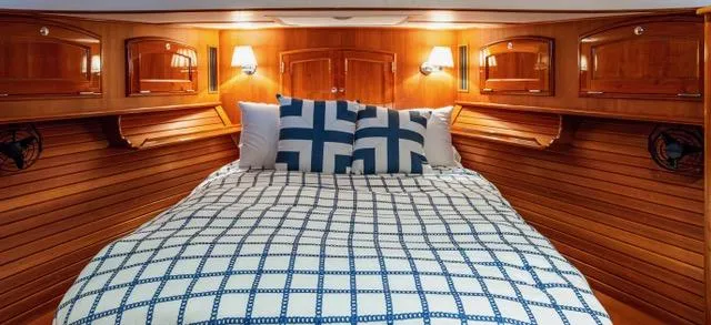 Virginia Yacht Photos Pics Luxurious cabin interior of 2013 Hinckley Talaria 48 Flybridge with elegant wood paneling.