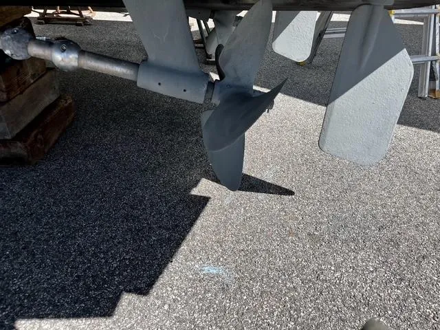  Yacht Photos Pics Propeller and rudder of a 2002 Carolina Classic 35 boat on pavement.