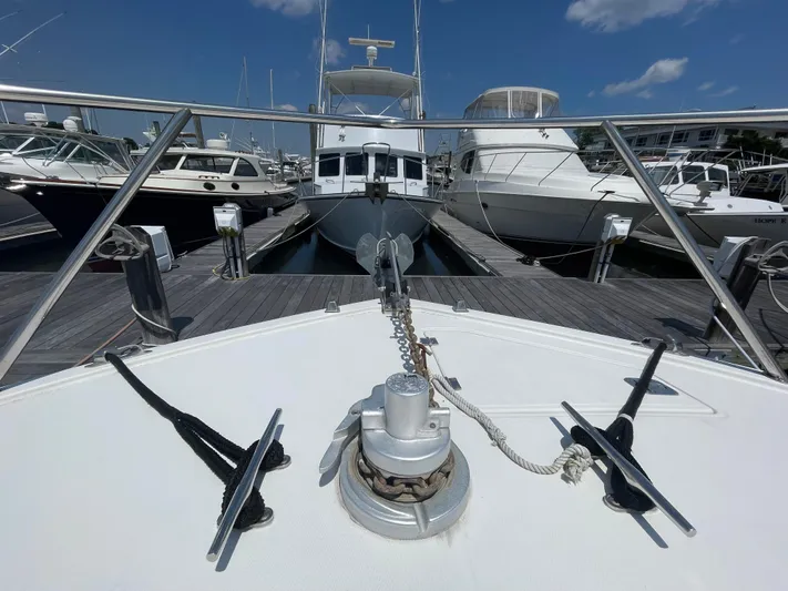  Yacht Photos Pics Bow view of a 2002 Carolina Classic 35 yacht docked at a marina.
