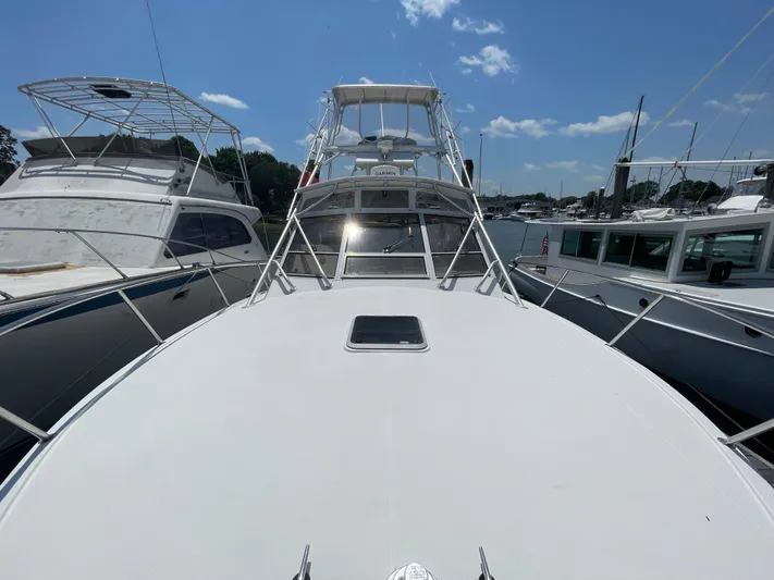  Yacht Photos Pics 2002 Carolina Classic 35 boat docked under clear blue sky.