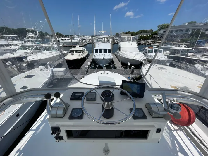  Yacht Photos Pics View from the helm of a 2002 Carolina Classic 35 yacht docked at a marina.