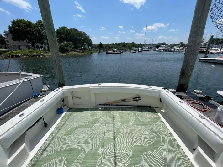 Yacht Photos Pics 2002 Carolina Classic 35 boat docked, featuring spacious deck and scenic marina view.