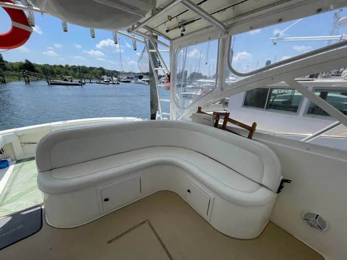  Yacht Photos Pics Interior of 2002 Carolina Classic 35 boat with white seating and marina view.