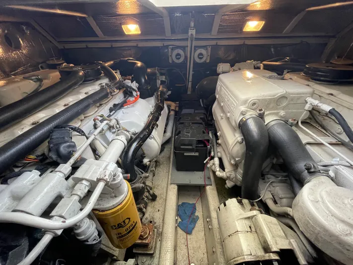  Yacht Photos Pics Engine room of a 2002 Carolina Classic 35 boat, featuring dual engines and mechanical components.