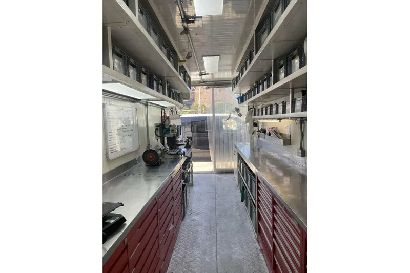 North Star Yacht Photos Pics Organized workshop interior with tools and storage, Judel and Vrolijk Maxi 72, 2009 model.