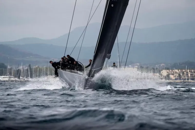 North Star Yacht Photos Pics Sailing yacht Judel and Vrolijk Maxi 72, 2009, cutting through waves with crew onboard.