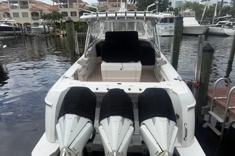 Day Dreams Yacht Photos Pics 2021 Intrepid 409 Valor boat docked with triple outboard engines.