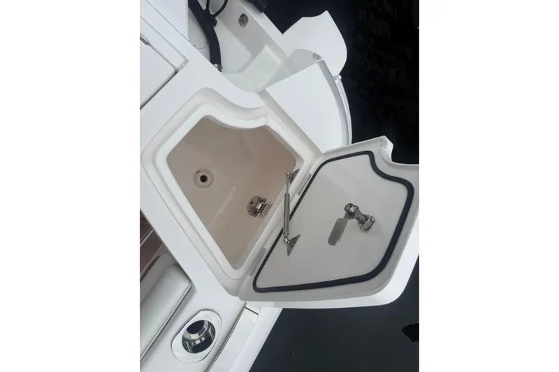 Day Dreams Yacht Photos Pics Open storage compartment on 2021 Intrepid 409 Valor boat, showcasing interior details.