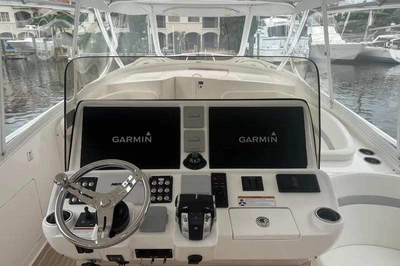 Day Dreams Yacht Photos Pics 2021 Intrepid 409 Valor boat helm with Garmin navigation displays and controls.