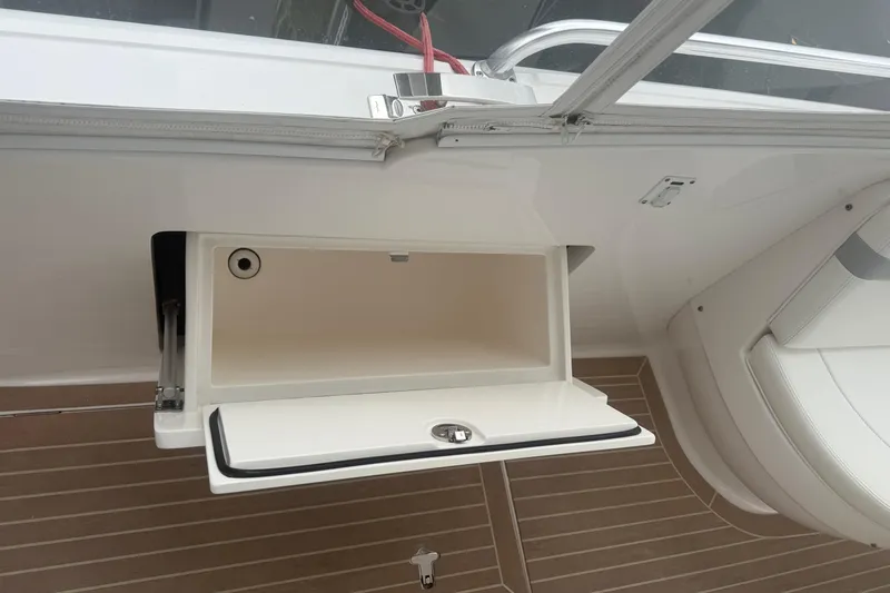 Day Dreams Yacht Photos Pics 2021 Intrepid 409 Valor boat storage compartment with open lid on teak deck.