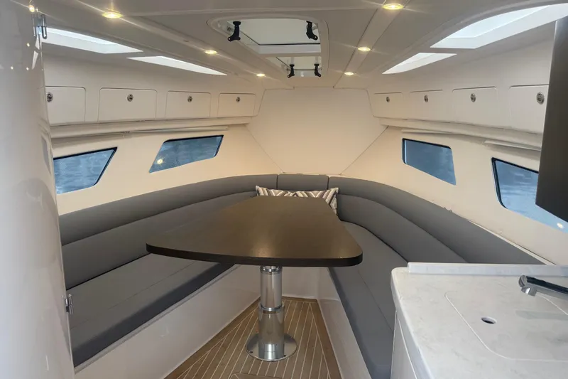 Day Dreams Yacht Photos Pics Luxurious interior of 2021 Intrepid 409 Valor boat with sleek seating and modern design.