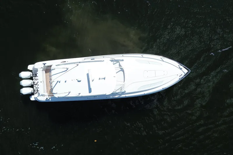 Day Dreams Yacht Photos Pics Aerial view of 2021 Intrepid 409 Valor boat on dark water.
