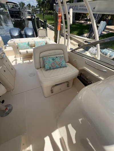 (no Name) Yacht Photos Pics 2019 Grady-White 275 boat interior with cushioned seating and decorative pillows.