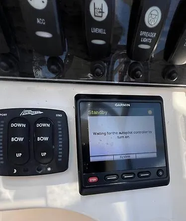 (no Name) Yacht Photos Pics Control panel of a 2019 Grady-White 275 boat with Garmin display and switches.