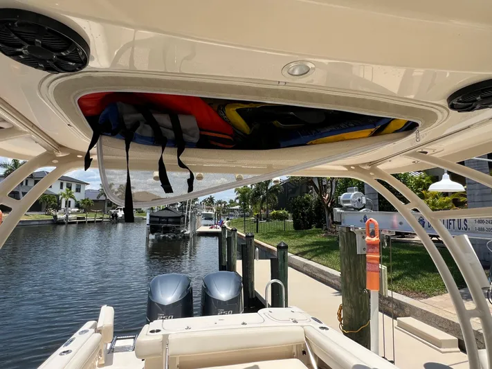 (no Name) Yacht Photos Pics 2019 Grady-White 275 boat with overhead storage, docked by a canal.
