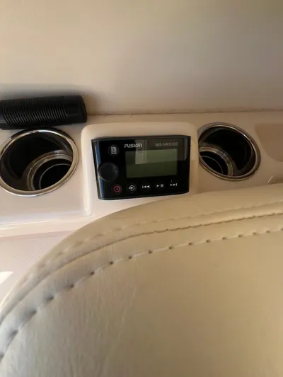 (no Name) Yacht Photos Pics Fusion MS-NRX300 stereo on 2019 Grady-White 275 boat dashboard with cup holders.
