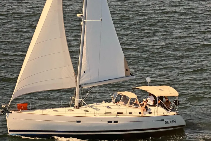 Gitana Yacht Photos Pics 2006 Beneteau Oceanis 523 sailboat cruising on open water with full sails.