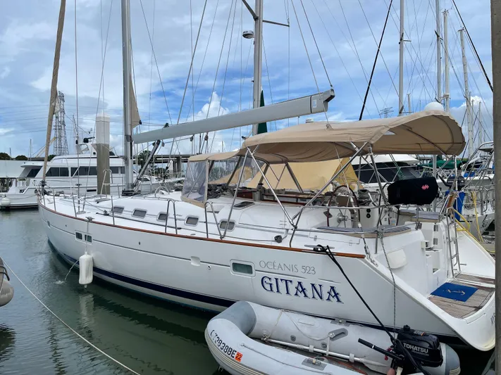 Gitana Yacht Photos Pics 2006 Beneteau Oceanis 523 sailboat docked at marina, featuring sleek design and spacious deck.
