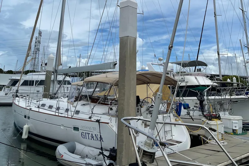 Gitana Yacht Photos Pics Beneteau Oceanis 523 sailboat docked at marina, 2006 model, with clear sky background.