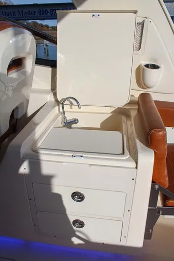 Scout 275 Dorado Yacht Photos Pics 2018 Scout 275 Dorado boat interior with sink and storage drawers.