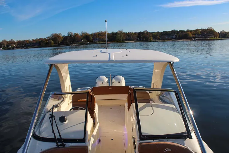 Scout 275 Dorado Yacht Photos Pics 2018 Scout 275 Dorado boat on a calm lake with clear skies.