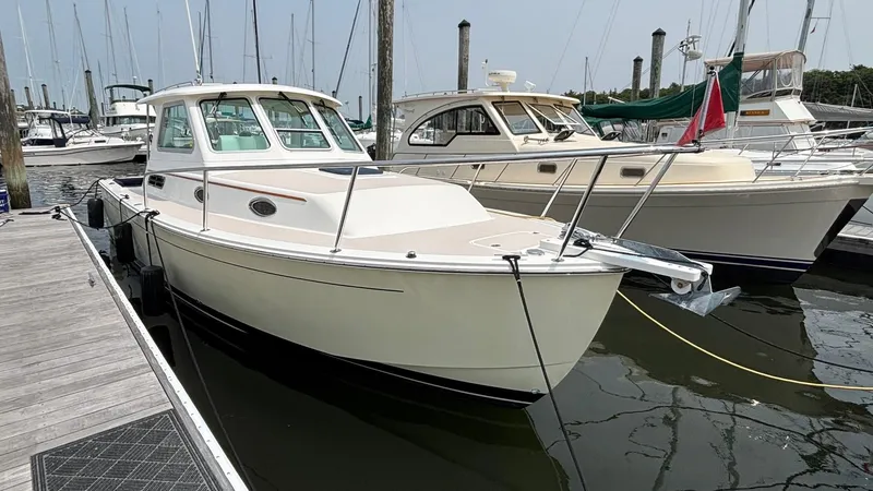 Uncle Ray Yacht Photos Pics 2004 Back Cove 29 boat docked at marina, surrounded by other vessels.