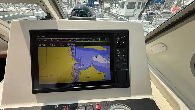 Uncle Ray Yacht Photos Pics Helm of 2004 Back Cove 29 with Garmin navigation display and compass.