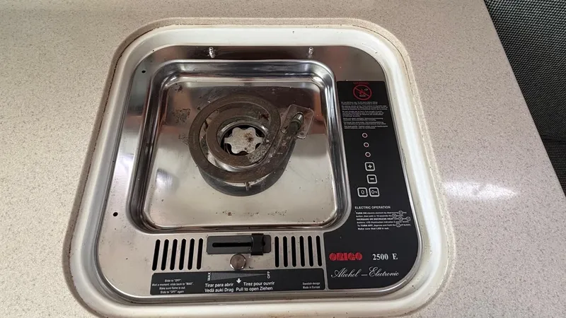 Uncle Ray Yacht Photos Pics Electric stove on a 2004 Back Cove 29 boat, featuring a single burner and control panel.