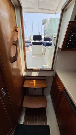 Uncle Ray Yacht Photos Pics 2004 Back Cove 29 interior with wooden steps and nautical decor.