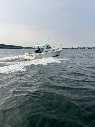 Uncle Ray Yacht Photos Pics 2004 Back Cove 29 boat cruising on open water.