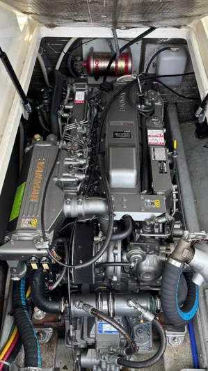 Uncle Ray Yacht Photos Pics Engine compartment of a 2004 Back Cove 29 boat, showcasing detailed mechanical components.