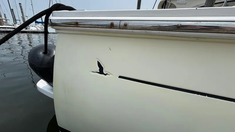 Uncle Ray Yacht Photos Pics 2004 Back Cove 29 boat with a visible logo and docked at a marina.