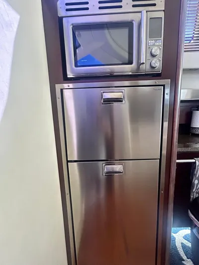  Yacht Photos Pics Microwave and stainless steel drawers in 2007 Sea Ray 44 Sedan Bridge yacht kitchen.