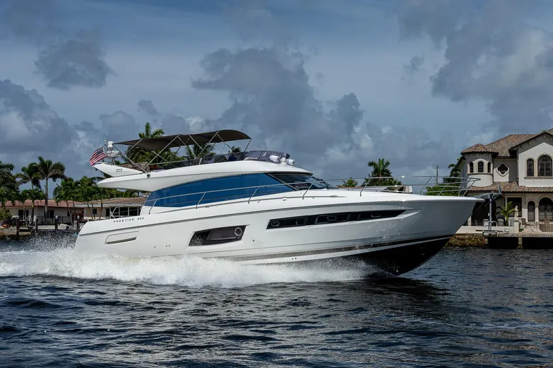 Lifesaver Yacht Photos Pics Luxury 2014 Prestige 550 yacht cruising near waterfront homes.