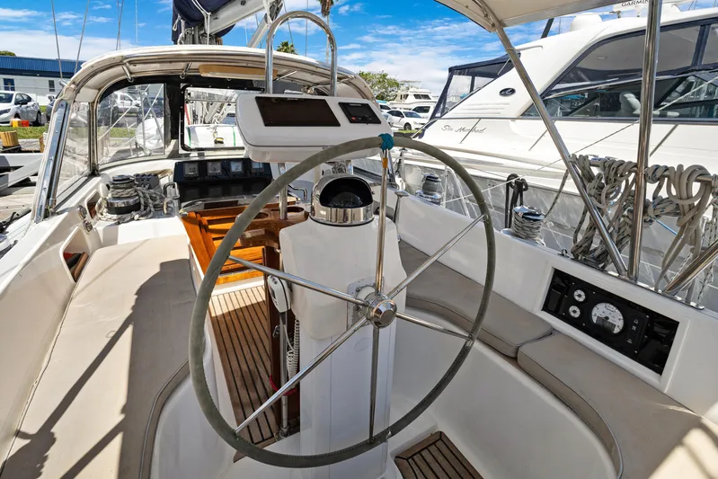 Southern Cross Yacht Photos Pics Cockpit of a 2004 Hylas 46 sailboat with steering wheel and navigation instruments.