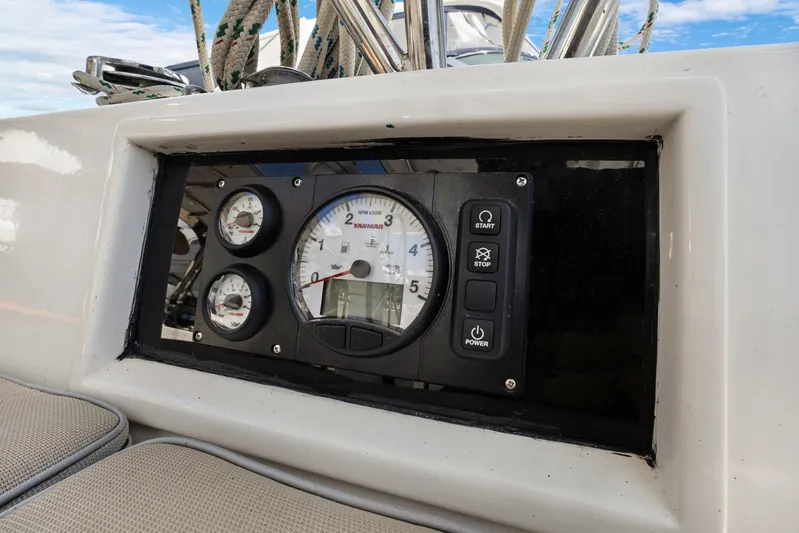 Southern Cross Yacht Photos Pics Control panel of a 2004 Hylas 46 yacht with gauges and buttons.