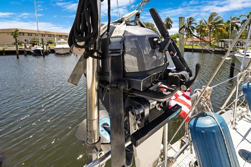 Southern Cross Yacht Photos Pics 2004 Hylas 46 sailboat with outboard motor docked in a marina.