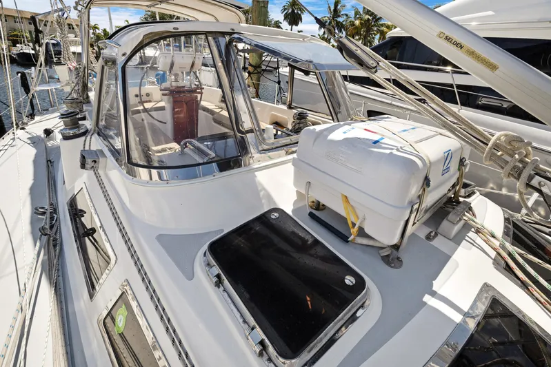 Southern Cross Yacht Photos Pics 2004 Hylas 46 sailboat deck with cockpit and rigging, docked in marina.