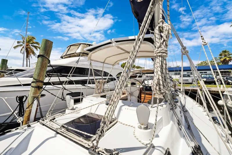 Southern Cross Yacht Photos Pics Sailboat docked at marina, Hylas 46 model, 2004, with clear blue sky background.