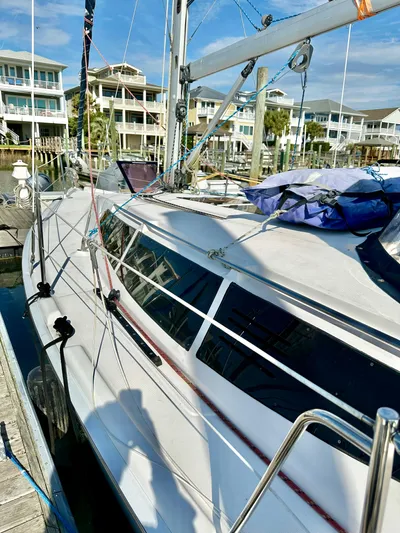 To The Gills Yacht Photos Pics Sailboat Hunter 33, 2014 model, docked near waterfront homes.