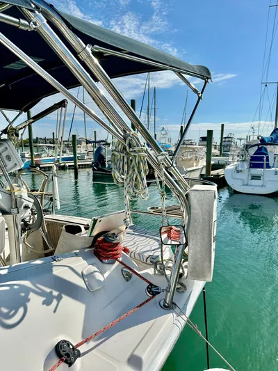 To The Gills Yacht Photos Pics 2014 Hunter 33 sailboat docked at marina under clear blue sky.