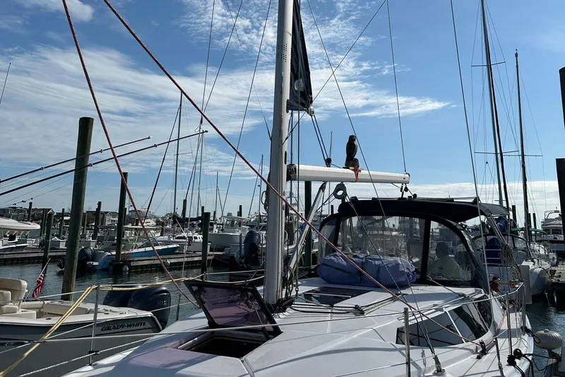To The Gills Yacht Photos Pics Sailboat Hunter 33, 2014 model, docked at marina under clear blue sky.