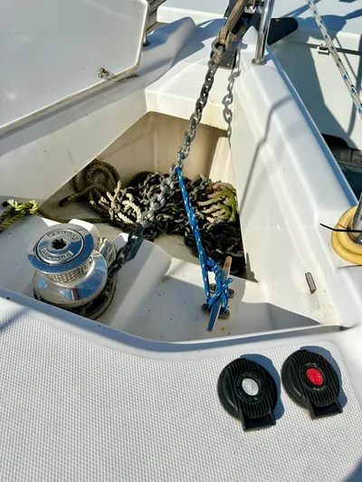 To The Gills Yacht Photos Pics Anchor chain and winch on a 2014 Hunter 33 sailboat deck.